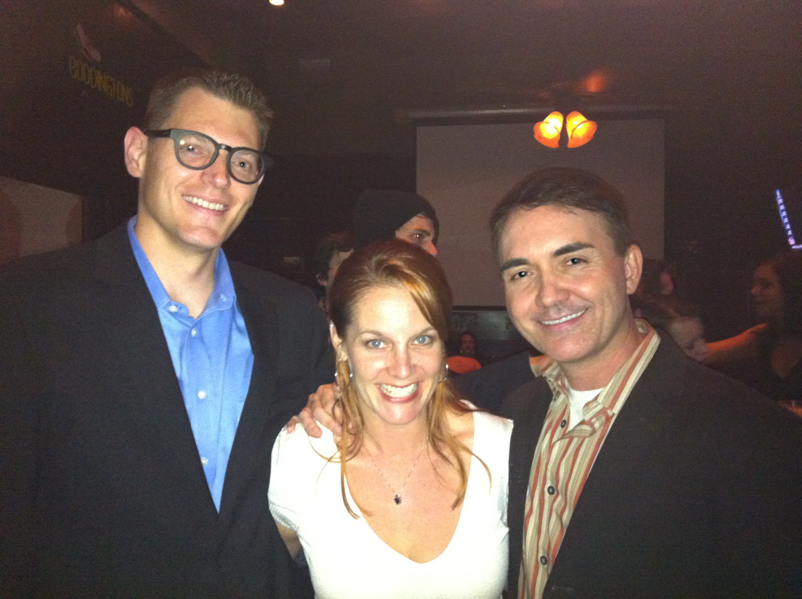 thommy hutson, jamie kristen, daniel farrands at a film launch party, men in black blazers and jamie in white sweater